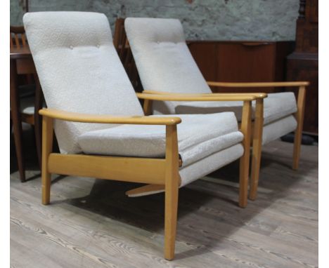 A pair of light beech reclining armchairs attributed to Greaves &amp; Thomas.  