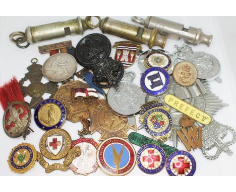 A mixed lot of badges and medals including Police, Red Cross, Coronation etc. together with an ARP whistle, a Metropolitan wh
