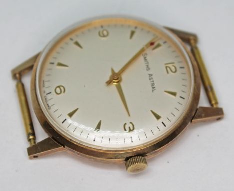 A 1950s Smiths Astral 9ct gold 17 jewel manual wind wristwatch with signed champagne dial gold hour markers, Arabic numbers a