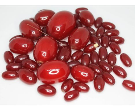 A single strand of cherry amber bakelite beads, gross wt. 73g.  Condition - in need of restringing, good striations when view