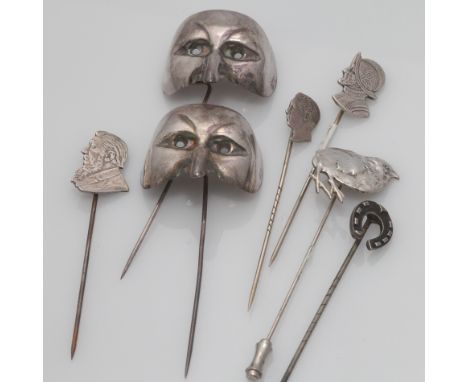 An interesting tie pin collection to include masks and portrait silhouettes (7), together with ten silver dress rings