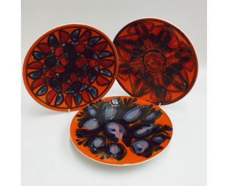 Three Poole Pottery plates, 26.5cm diameter 