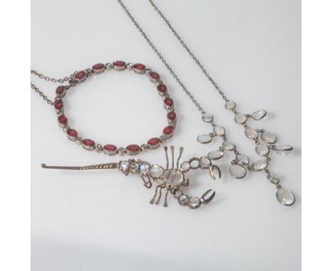 Edwardian moonstone fringe necklet, moonstone set scorpoin brooch and a French paste faux ruby line bracelet