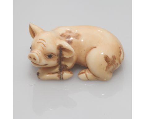 Early 20th C carved Japanese ivory netsuke in the form of a piglet, signed to the base 5cm long   Condition - old crack by th