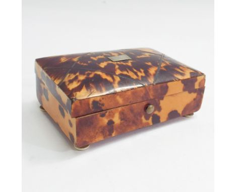 19th century blonde tortoiseshell veneered trinket box inlaid with white coloured metal on turned ivory feet.  8.5cm wide 