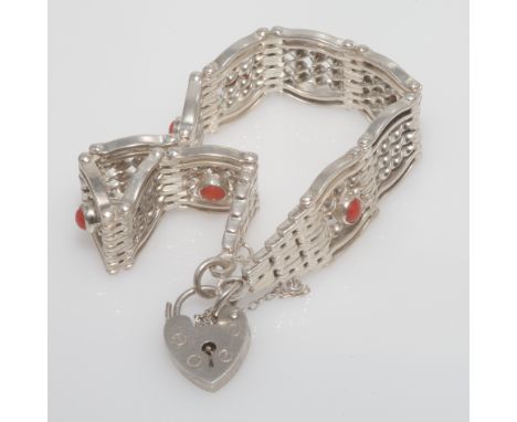 Silver gate bracelet, alternate links set with a circular coral bead. Heart shaped padlock fastening stamped Silver.  Conditi