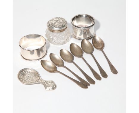 A collection of small silverware to include two silver napkin rings, continental caddy spoon, set of 6 coffee spoons and a si