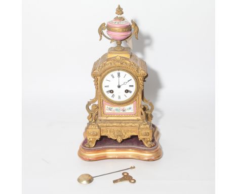 French porcelain panelled gilt metal mantel clock with pendulum and key on gilt wood base 40cm high  Condition - good overall