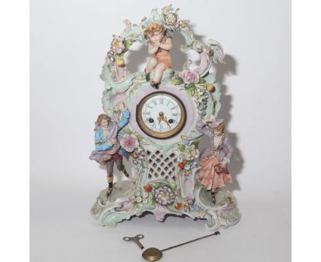Striking mantel clock in figure decorated Meissen style porcelain case, 13" wide x 18" high