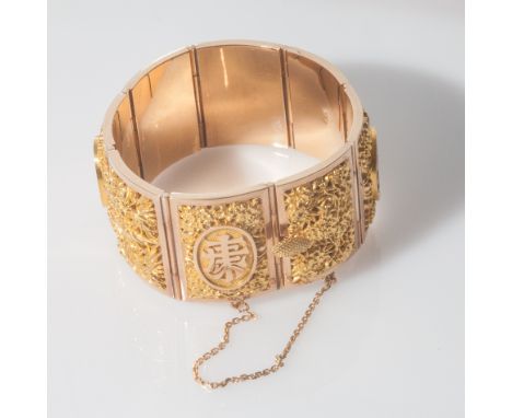 Chinese 18ct yellow gold bangle, set with 8 rectangular panels overlaid with pierced filigree design depicting seasons and sy