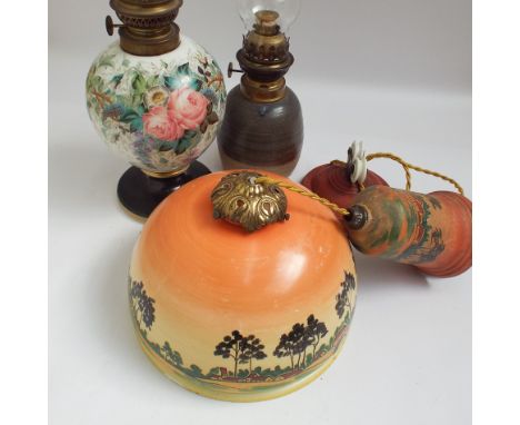 Floral painted opaque glass oil lamp, pottery oil lamp and a hanging glass light pendant 