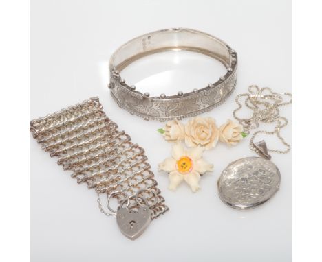 Ladies silver hinged bangle, 2 carved bone floral brooches, silver locket and a gate bracelet   bangle with small dent