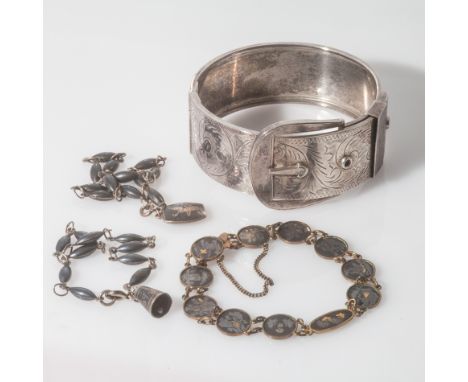 Victorian silver bangle with buckle design clasp, unhallmarked. Weight 46.5 grams, together with two oriental bracelets