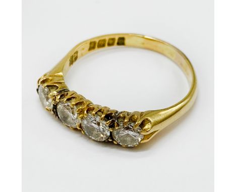 18CT GOLD FOUR-STONE DIAMOND RING