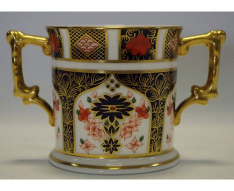 A Royal Crown Derby Imari 1128 pattern loving cup, cylindrical body on circular foot, printed marks to base, first quality 