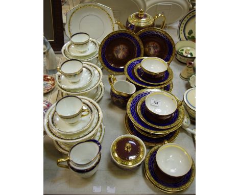 A 20th century Carlsbad Vienna porcelain tea service for six, each with neoclassical alegorical panels, within blue, yellow a