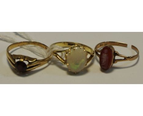 A 9ct Gold Opal Ring, a 9ct gold cameo ring, a gents 9ct gold garnet set ring, gross weight 6.5g, 