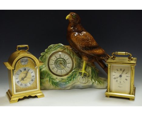 A 'JEMA' Holland Porcelain Mantel Clock, surmounted by an eagle, a Rapport carriage clock, another similar (3).