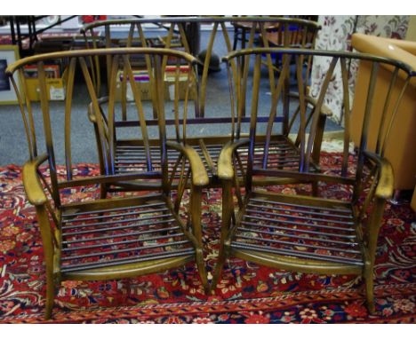 An Ercol style country cottage three suite comprising two seat settee and two armchairs.