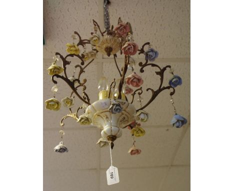 An early 20th century gilt metal and ceramic chandelier with blue, white yellow &amp; blue drops in the form of roses
