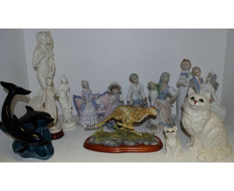 A Beswick Cat 1867, another smaller, Nao and Tengra figures, Poole Dolphins, Border fine art cheetah, etc. (13).