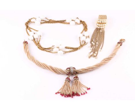 A Chanel simulated pearl necklace, the twisted multi strand necklace centrally suspending two tassels with paste red and whit