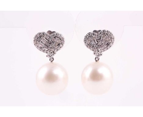 An pair of Southsea pearl and diamond earrings, the heart shape drop earrings feature princess cut, tapered baguette-cut and 