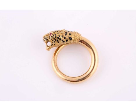 A French Panther head torque ring with ruby eyes and enamel spots in yellow metal, stamped France, 18k, 750, ring size L 1/2,
