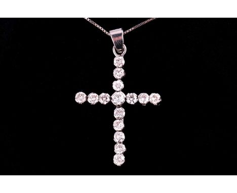 A diamond set cross and chain, set with round brilliant cut diamonds with an estimated weight of 1.50ct on a white metal box 