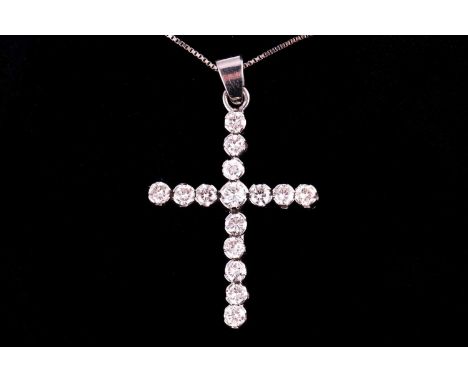 A diamond set cross and chain, set with round brilliant cut diamonds with an estimated weight of 1.50ct on a white metal box 