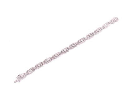 A vintage Art Deco style diamond bracelet, consisting of twelve articulated sections set with round brilliant cut diamonds wi