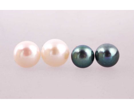 Two pairs of freshwater pearl earrings, one pair with a light cream 9.5-10mm bouton pearl to each, the other pair with 'peaco