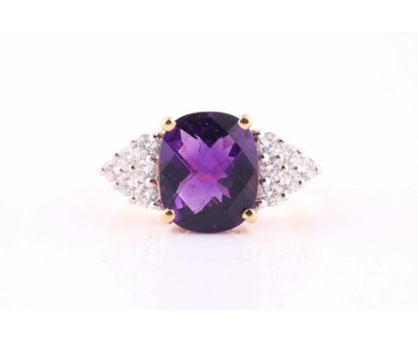 An amethyst and diamond ring, the faceted cushion shape amethyst with six round brilliant cut diamonds to each shoulder, esti