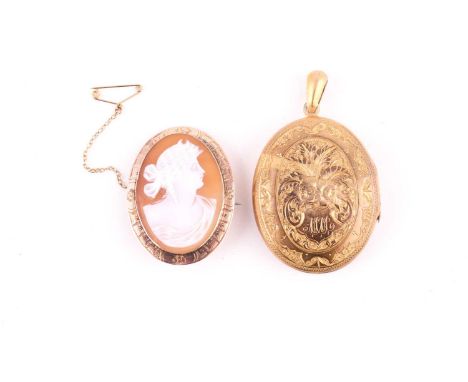 A yellow metal mounted cameo brooch, depicting a female profile with an engraved border, measuring 4x3cm with a safety chain 