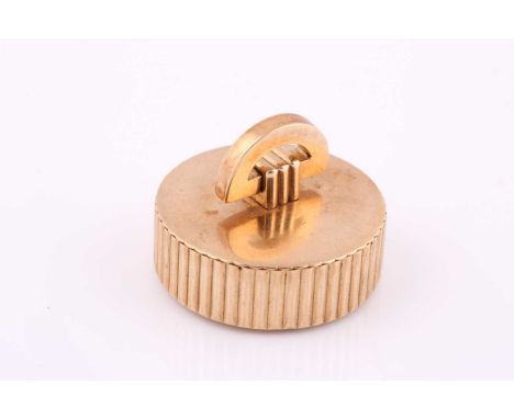 A Cartier 9ct gold pill box, London 1943, the pull off cover with D shaped loop on a reeded cylindrical body, 21.8grams.Condi
