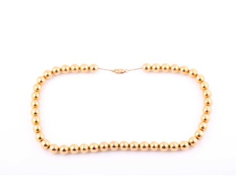 A 9ct yellow gold necklace, with 19.5-inch long Box link chain with fourty four free running round beads/balls measuring 10.2