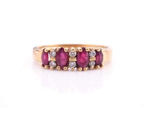 An 18ct yellow gold, ruby and diamond eternity ring, set with graduating marquise cut rubies measuring 4-5mm alternating with