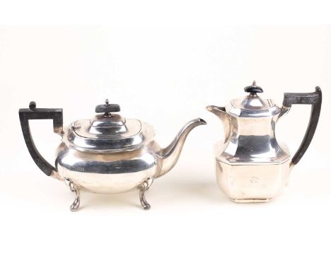 A  pot-bellied silver teapot, Sheffield 1932 by Walker &amp; Hall, together with a non-matching silver hot water jug Sheffiel