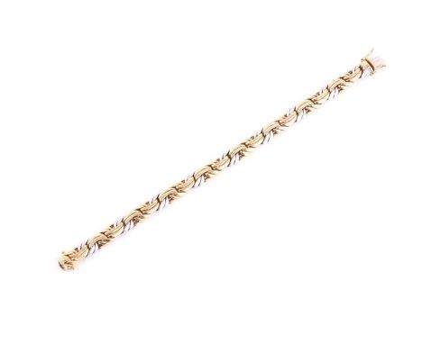 An 18ct yellow and white gold two-tone bracelet, with interwoven links, the clasp stamped .750. 19.5 cm long.Condition report