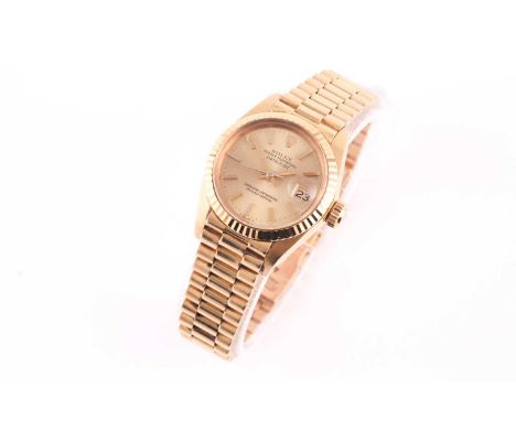A Rolex Lady-Datejust 26mm superlative chronometer with an automatic movement in 18ct yellow gold with gold dial, gold indexe