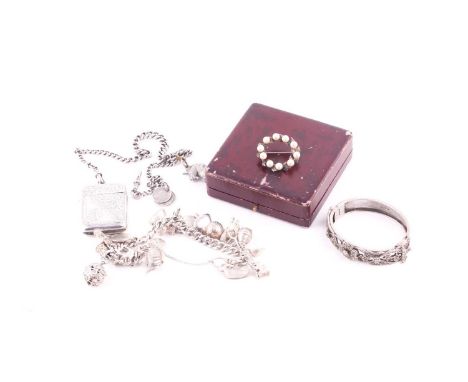 A Victorian silver vesta case, engraved G.F.Bomwick and with a monogram, Birmingham 1878, on a tapered silver curb link watch