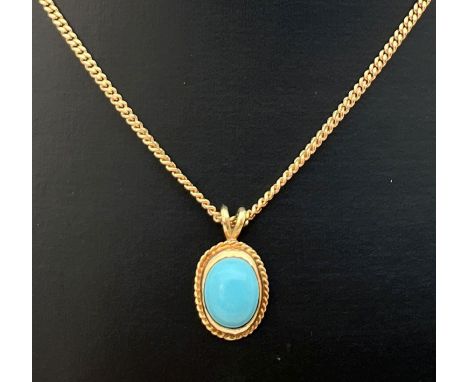 A turquoise and 9ct gold oval shaped pendant on an 18" 9ct gold curb chain. Chain hallmarked to fixing ring and stamped 10k t