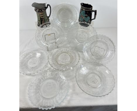 A collection of 9 moulded glass coronation plates together with 2 antique ceramic jugs. Commemorative plates for: Victoria, G