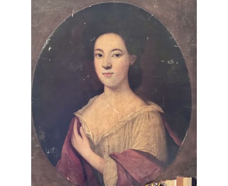 Circle of Enoch Seeman (1694-1744), portrait of a young lady, half length, oil on canvas, oval lay down on board. 66cm x 56cm