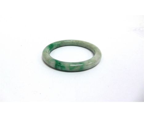 A JADE BANGLE  of round section, 11.5mm thick, outer diameter 9.8cm, inner diameter 7.5cm, 98g gross