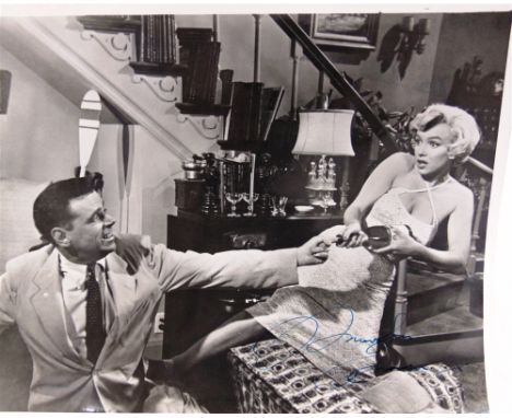 AUTOGRAPHS - MARILYN MONROE  A black and white portrait still from 'The Seven Year Itch', signed 'Marilyn Monroe' in blue ink