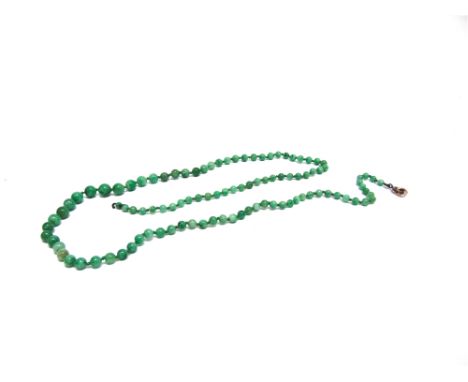 A GRADUATED ROW OF JADE BEADS  the one hundred and two beads of approximately 3.9/8mm diameter, 65cm long to a bolt ring clas