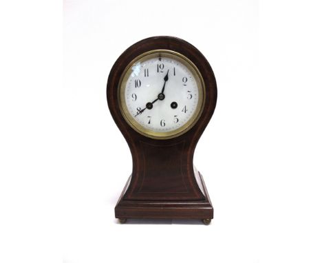 AN EDWARDIAN MAHOGANY BALLOON SHAPED MANTLE CLOCK  the enamel dial with Arabic numerals, the twin train 8-day movement striki