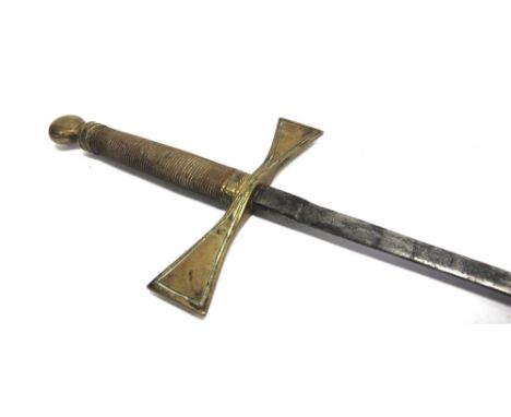 A MASONIC SWORD  the 70.5cm steel blade with engraved decoration (now rubbed and indistinct), the brass hilt with a copper wi