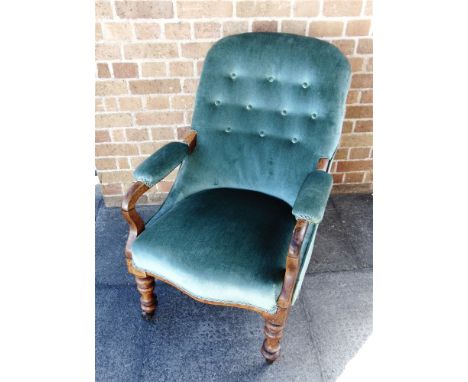 A RE-UPHOLSTED VICTORIAN OPEN ARMCHAIR  with button upholstered back, serpentine front seat on turned front supports with bra